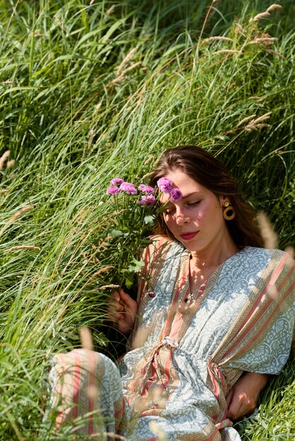 High angle woman laying on grass