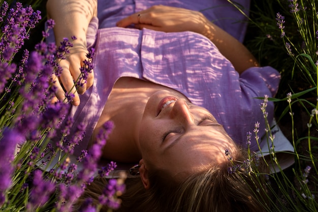 High angle woman laying in lavender field