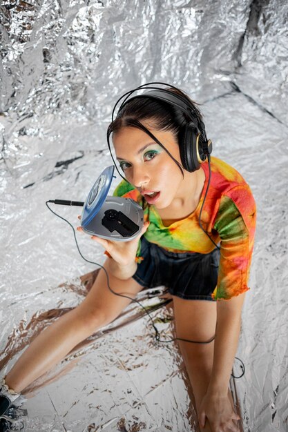 High angle woman listening to music