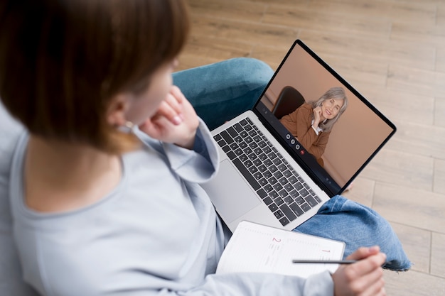 Free photo high angle woman making a video call