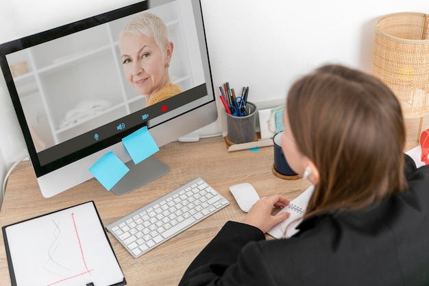 Free photo high angle woman making a video call