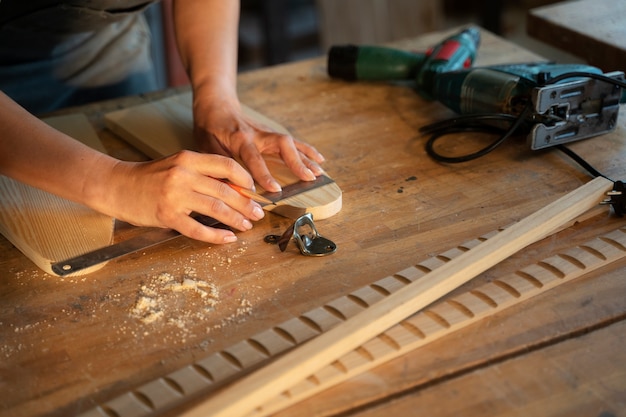 High angle woman measuring with ruler