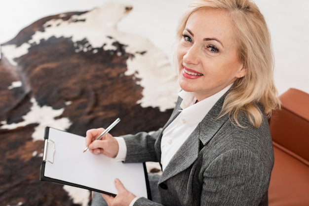 Free photo high angle woman at office