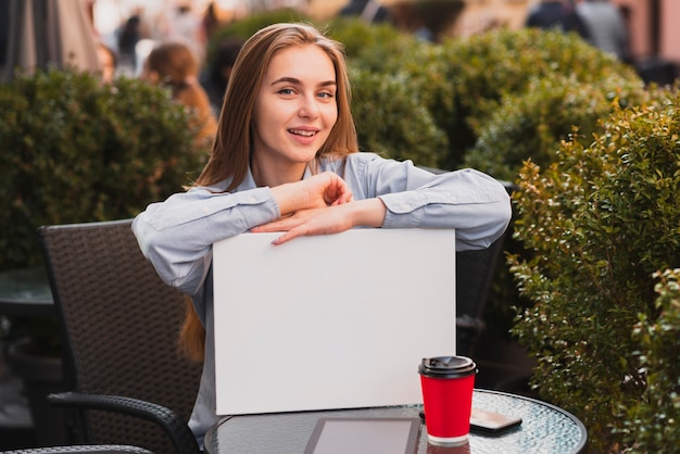 Free photo high angle woman outdoors for a coffee