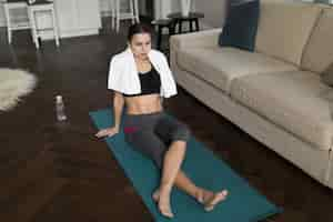 Free photo high angle of woman relaxing on mat after yoga