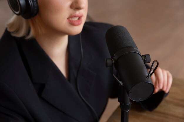 High angle woman talking at podcast