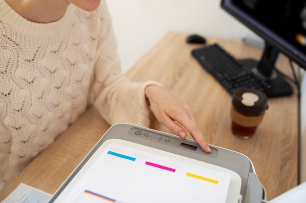 High angle woman using printer