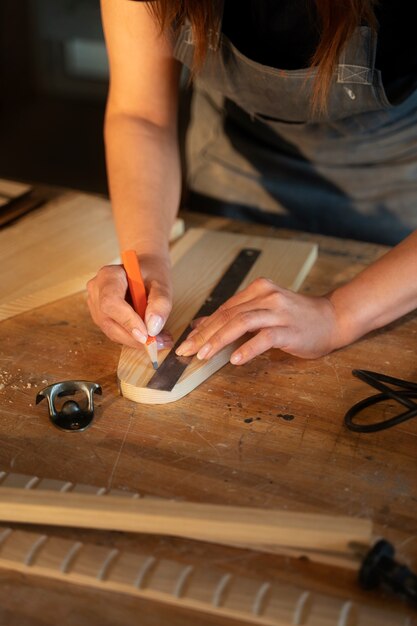 High angle woman using ruler