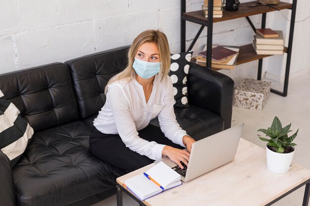 High angle woman wearing mask