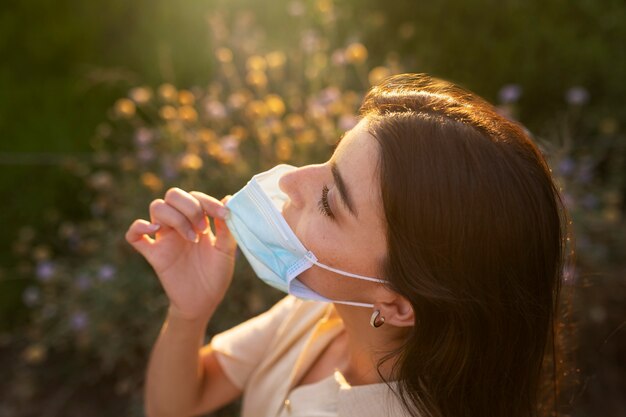 Free photo high angle woman with face mask