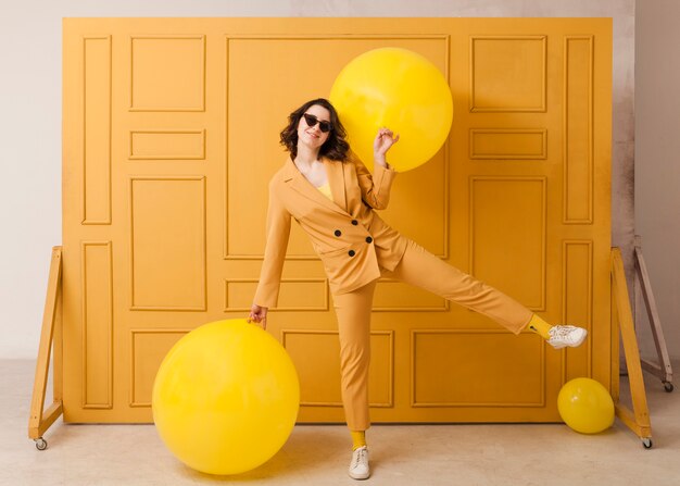 High angle woman with yellow balls