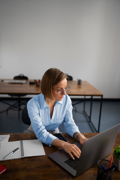 High angle woman working as economist