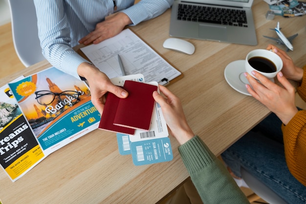 Free photo high angle woman working as a travel agent