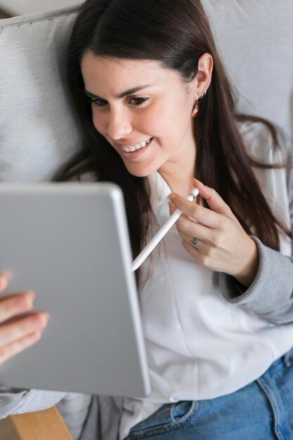 High angle woman working on tablet