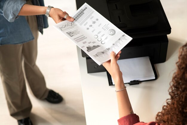 High angle women holding paper