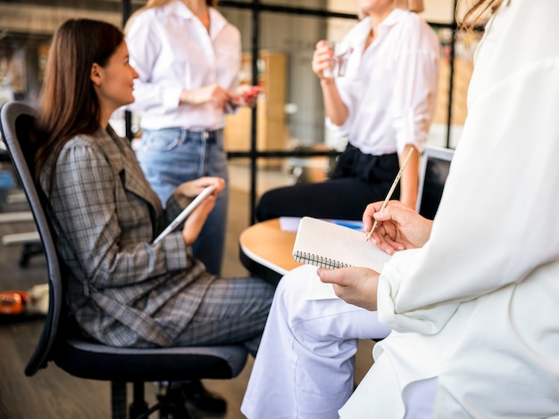 Free photo high angle women meeting at office