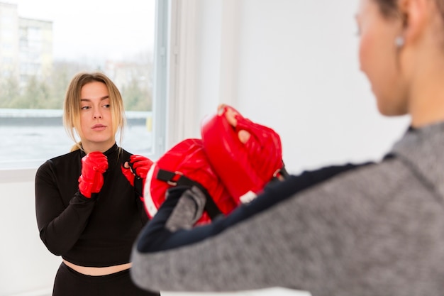 Free photo high angle women practicing box