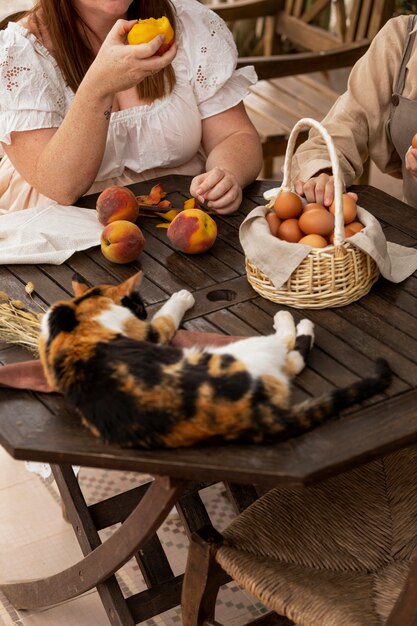 High angle women with eggs basket