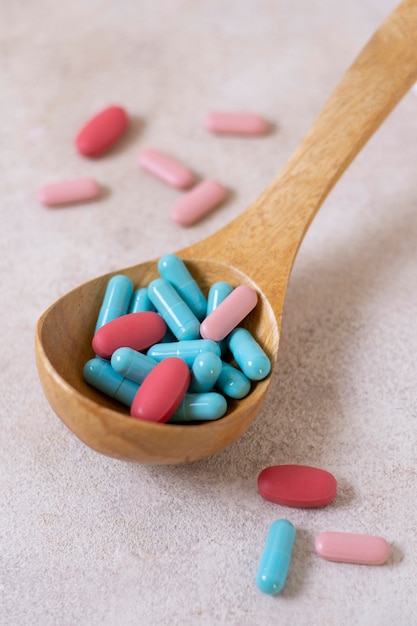 High angle wooden spoon with pills