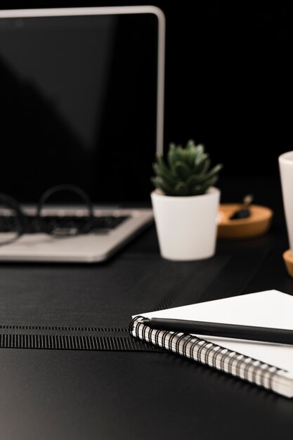 High angle of workstation with notebook and laptop