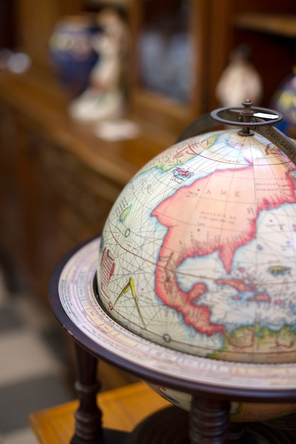 Free photo high angle world globe at the antique store