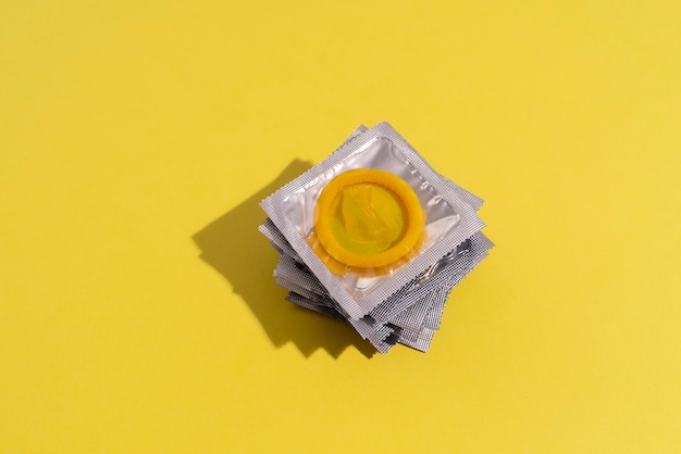 High angle yellow condoms arrangement