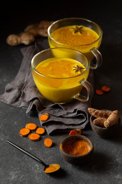 High angle yellow drink with star anise