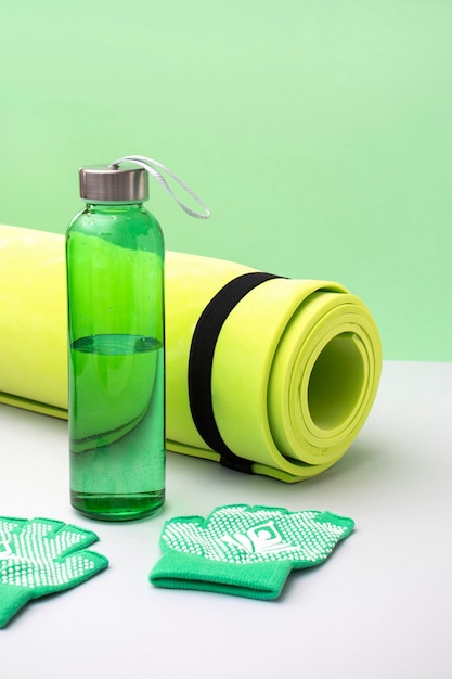 High angle yoga mat and water bottle arrangement