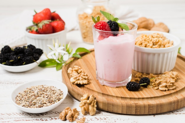 High angle of yoghurt glass with fruits