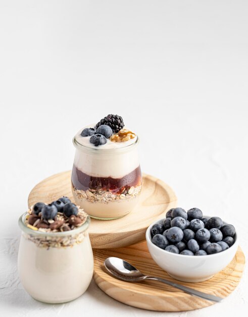 High angle yogurt mix with fruits, jam and oats