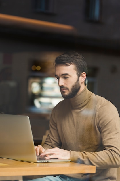 High angle young entrepreneur working