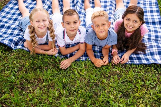 High angle young friends looking at camera