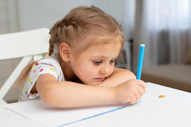 High angle young girl drawing