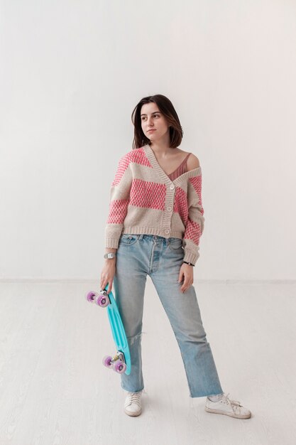 High angle young girl with skateboard