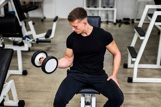 Free photo high angle young man arms training