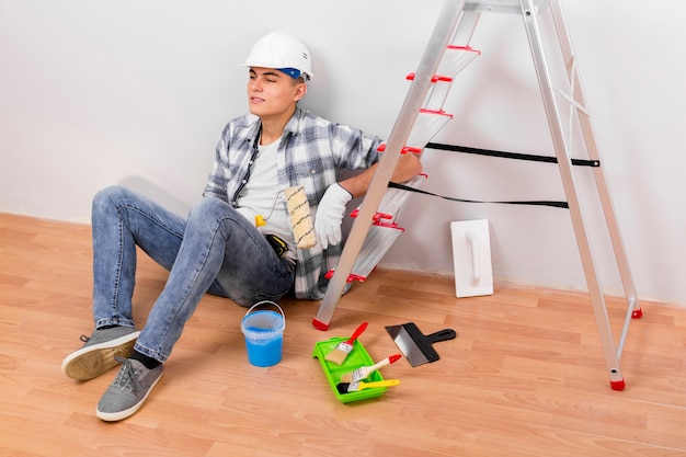 high angle of young man taking a break