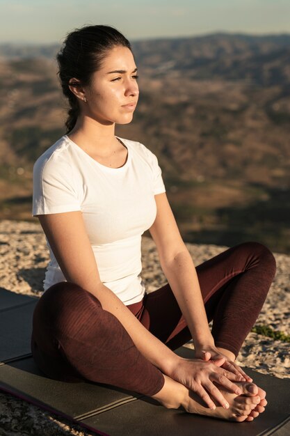 High angle young woman meditating