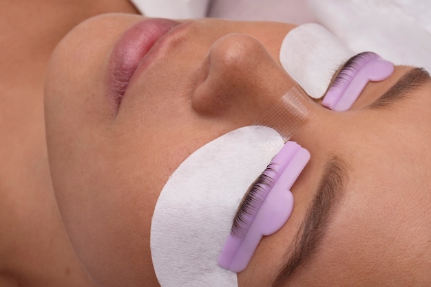 High angle young woman wearing eye patches