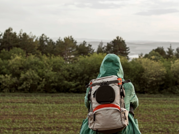 Free photo high angle young woman with backpack