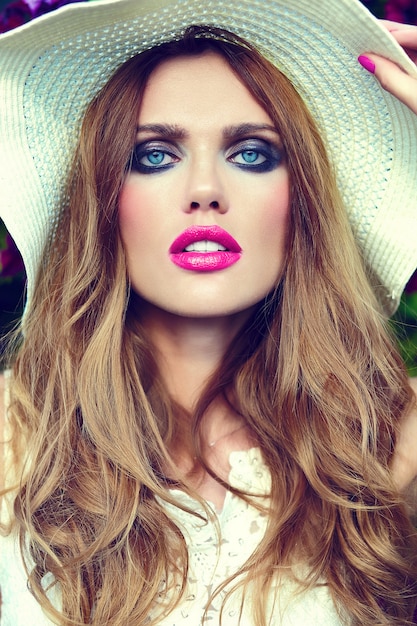 High fashion look.glamor closeup portrait of beautiful sexy stylish blond young woman model with bright makeup and pink lips with perfect clean skin in hat blue eyes