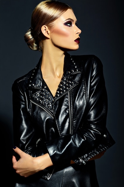 high fashion look.glamor closeup portrait of beautiful sexy stylish blond  young woman model with bright makeup with red lips with perfect clean skin in black cloth