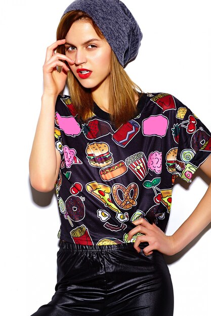 High fashion look.glamor stylish beautiful  young woman model with red lips  in hipster cloth in  beanie