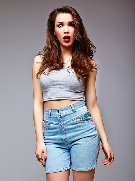 High fashion look.glamor stylish sexy surprised beautiful young woman model in summer bright jeans shorts hipster cloth