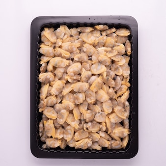 High quality frozen and thaw seafood packed in tray with iqf process, individual quick frozen using for food and seafood industry design. Premium Photo
