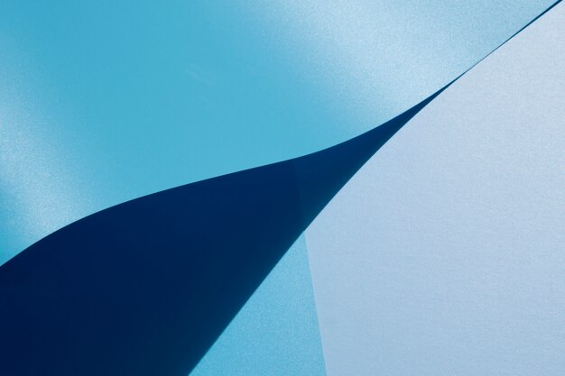 High view of blue curved sheets of paper