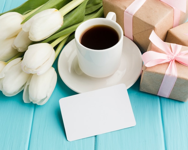 High view bouquet of tulip flowers with morning coffee