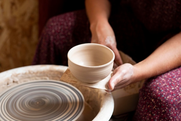 High view bowl made from clay on a potter's wheel