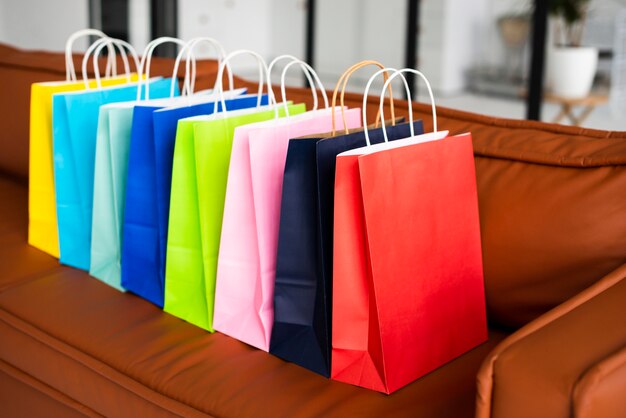 High view of colourful paper bags on couch