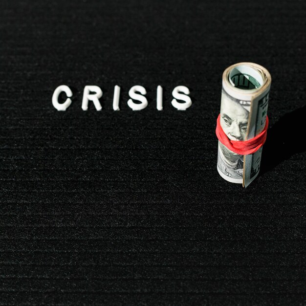 high view crisis word and roll of banknotes