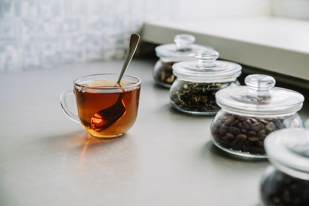 High view of cup of tea and herbs